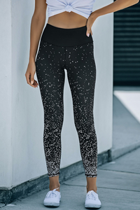 Leggings pretas espalhadas por pontos Stockpapa